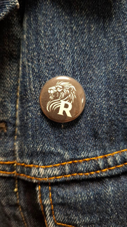 Button "REVOLTRA Löwe"